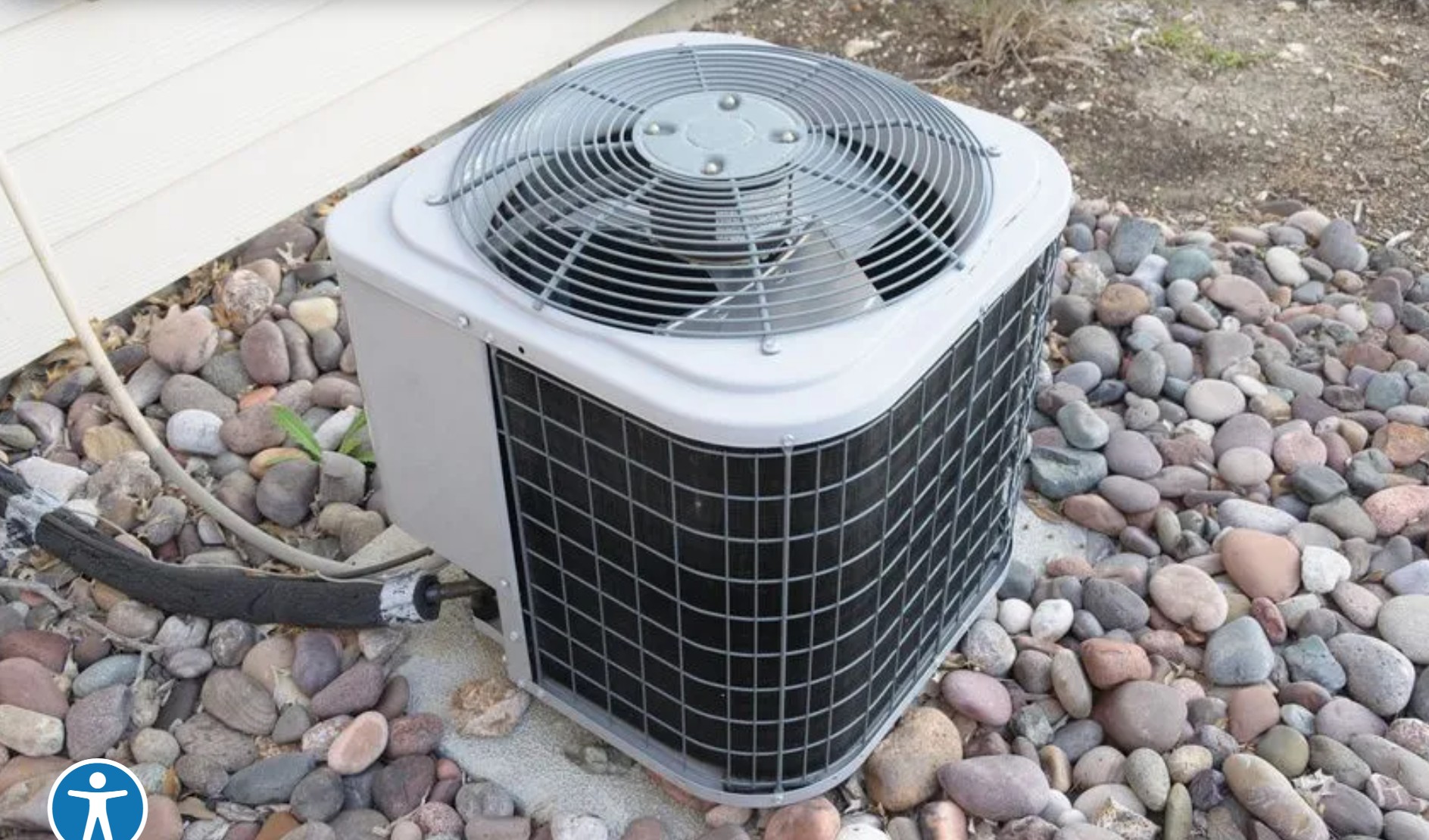 Technician repairing a condenser